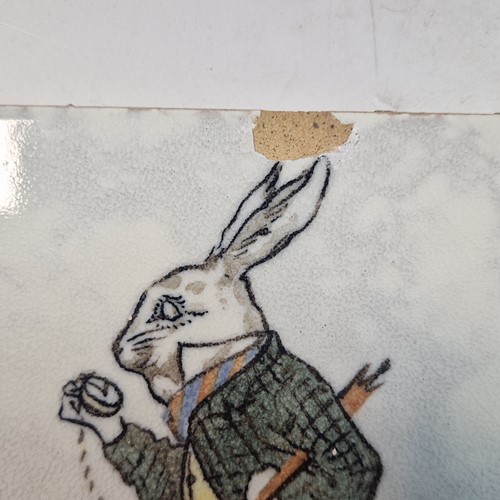 Lot 30 - Minton, after Charles Francis Annesley Voysey, a set of seven Alice in Wonderland tiles