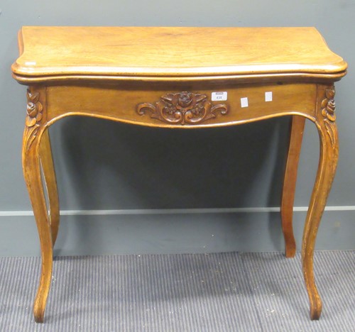 Lot 438 - A Louis XV style floral carved serpentine card...