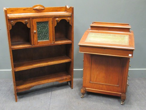 Lot 437 - An Edwardian Arts & Crafts oak open bookcase,...