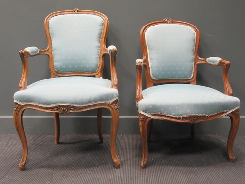 Lot 423 - A near pair of Louis XV style carved beech...