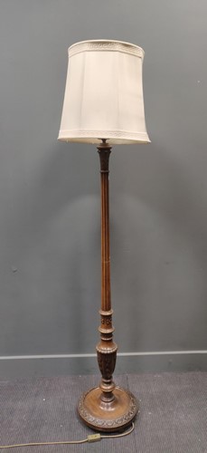 Lot 411 - A carved reeded column standard lamp