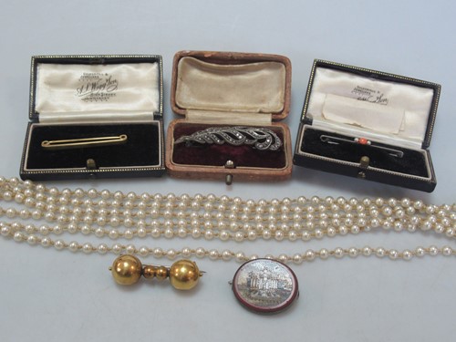 Lot 157 - A stock pin brooch stamped '15CT', weight 2.7g,...