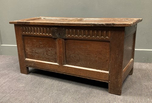 Lot 427 - An 18th century oak coffer with hinge double...