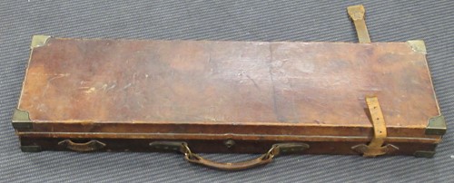 Lot 124 - Stephen Grant, an oak and leather shotgun...
