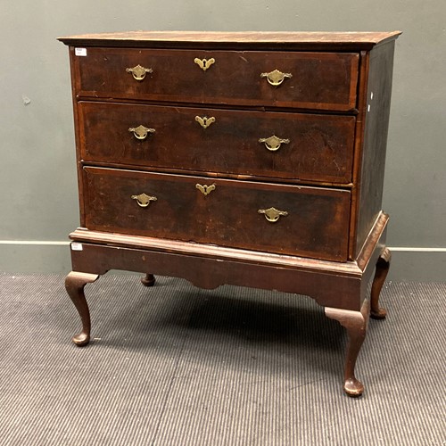Lot 357 - An 18th century walnut chest on stand, the...