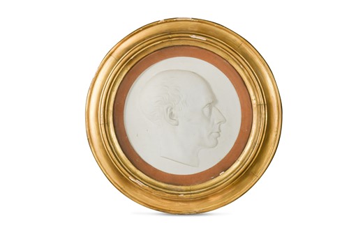 Lot 583 - A high-relief painted plaster profile portrait of a gentleman
