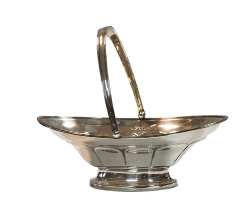 Lot 604 - A George V silver swing handled cake basket