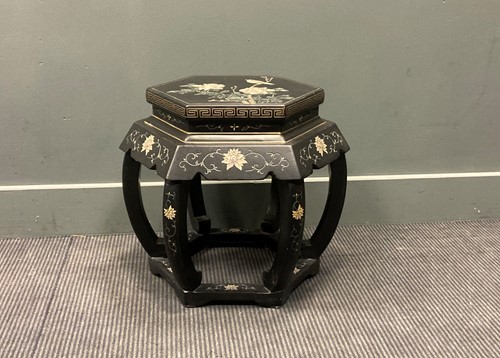 Lot 399 - A Japanese lacquered stool, the inlaid top...