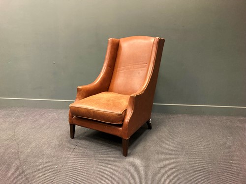Lot 379 - A large leather armchair, 117 x 74 x 110cm