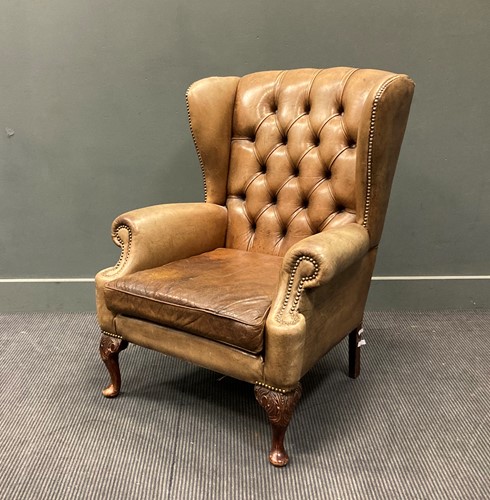 Lot 378 - A modern George II style leather wing back...