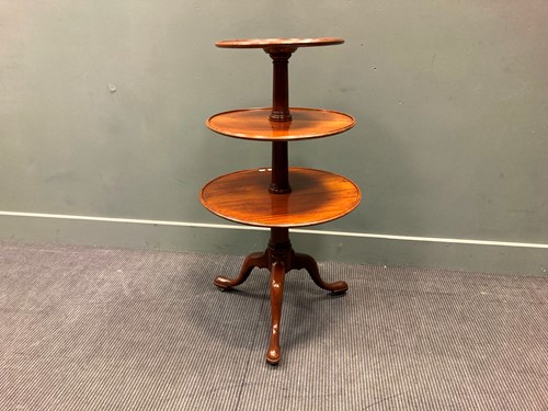Lot 365 - A Georgian mahogany three-tier dumb waiter on...