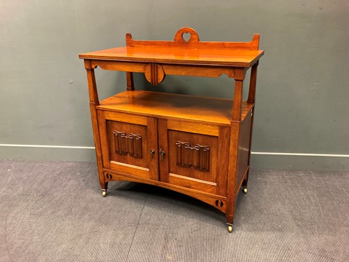 Lot 393 - In the manner of Charles Voysey, an Arts &...