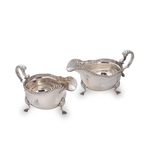 Lot 449 - A visual pair of George V silver sauce boats