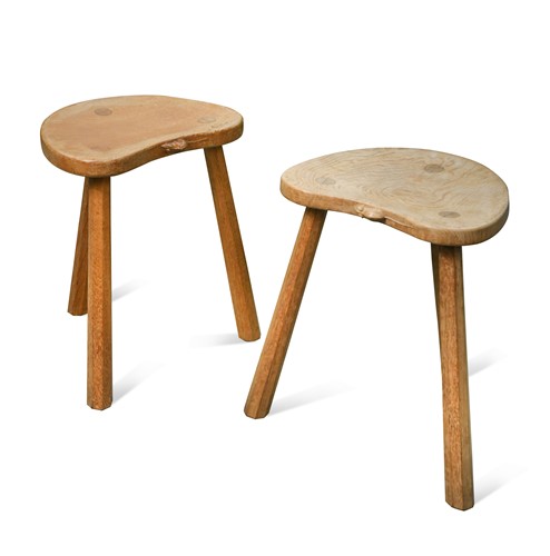 Lot 228 - Robert 'Mouseman' Thompson, a pair of three-legged oak stools