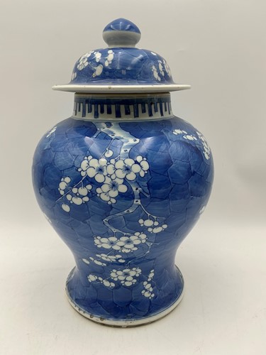 Lot 206 - A Chinese blue and white porcelain prunus and crackled ice vase and cover, Qing Dynasty, 19th century