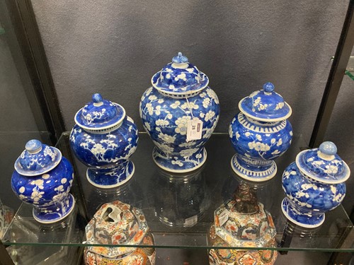 Lot 47 - A group of five Chinese blue and white porcelain vases, Qing Dynasty, 19th century