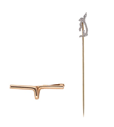 Lot 28 - A brooch and diamond set stick pin