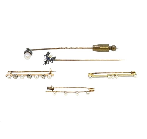 Lot 35 - Three pearl brooches, together with two diamond set stick pins