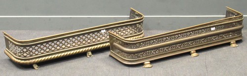 Lot 345 - Two 19th century brass fenders, 129cm and...