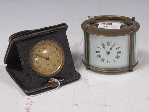 Lot 30 - A 20th century oval shape carriage timepiece,...