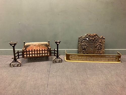 Lot 456 - A cast iron fire back with pair of inset...