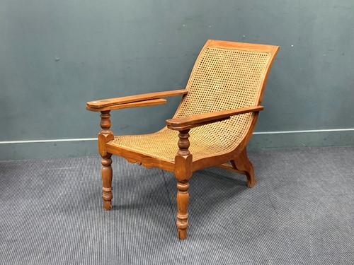 Lot 333 - A teak plantation chair, early 20th century,...