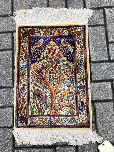 Lot 378 - A Hereke rug decorated with animals around a...