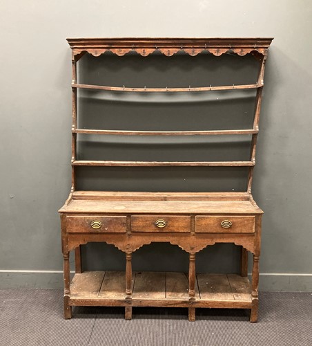 Lot 355 - An 18th century oak small dresser, with raised...