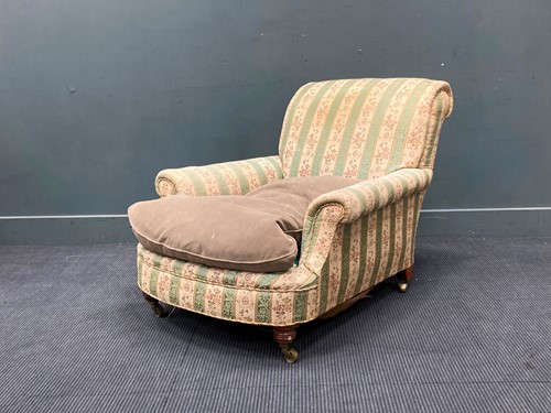 Lot 360 - An Edwardian low upholstered armchair on...