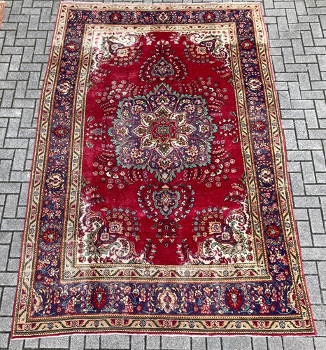 Lot 381 - A North West Persian rug, with red ground and...