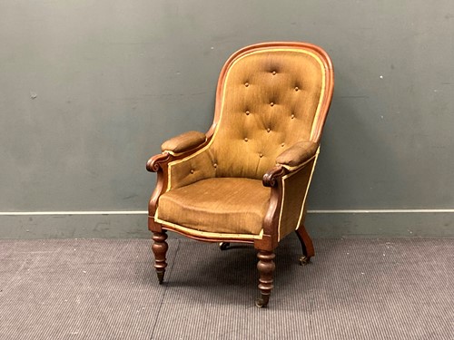 Lot 423 - An early Victorian button back easy armchair...
