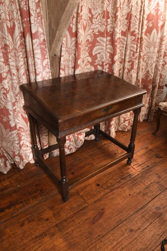 Lot 394 - An oak writing desk, 18th century