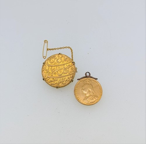 Lot 182 - A full sovereign dated 1887, together with an...
