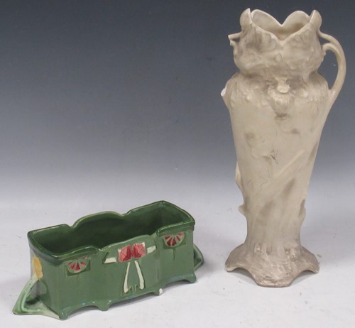 Lot 31 - An Art Nouveau green glazed rectangular...