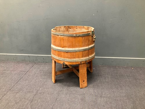Lot 439 - A coopered pine cistern with side carrying...