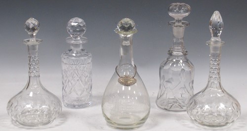 Lot 47 - A collection of five cut glass decanters, one...