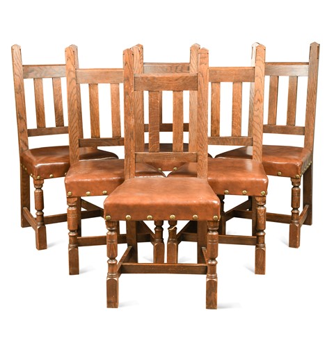 Lot 202 - Liberty & Co., a set of six Arts & Crafts oak 'Arrowhead' chairs