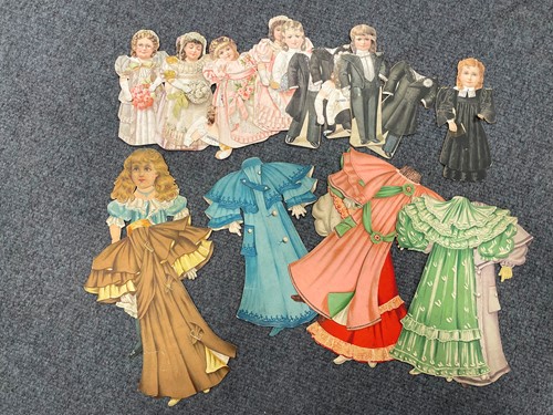 Lot 329 - A Raphael Tuck cut card doll with outfits circa 1900
