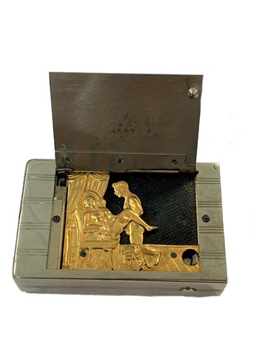 Lot 400 - A chromed vesta case with secret erotic mechanism