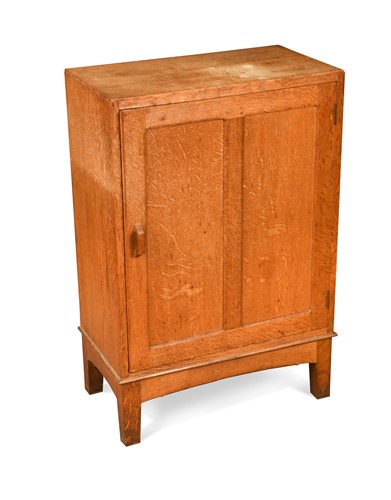 Lot 221 - A small Cotswold School oak cupboard