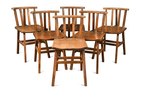 Lot 206 - In the manner of Arthur Romney Green, a set of six oak stick back chairs