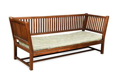 Lot 204 - Attributed to Liberty & Co., an Arts & Crafts mahogany settle