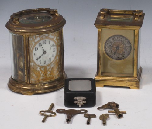Lot 29 - A French oval carriage clock (glass cracked)...