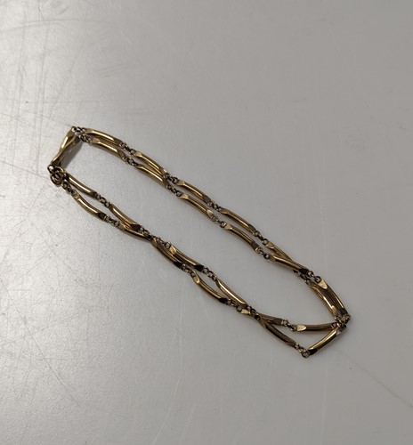 Lot 336 - A bar link chain, unmarked, tested as 9ct gold,...