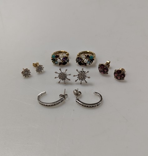 Lot 323 - A pair of diamond set hoop style earrings,...
