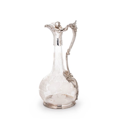 Lot 461 - A late 19th century silver plated and glass claret jug