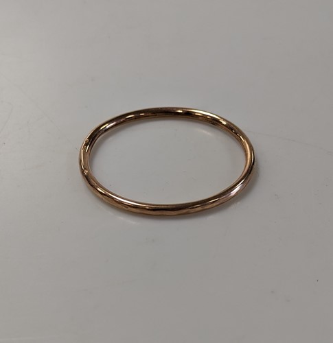 Lot 341 - An arm bangle stamped '9ct', weight 9.5g