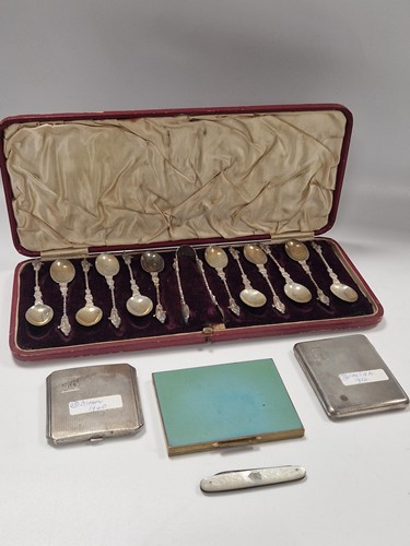 Lot 398 - A silver cigarette case, a silver compact, a...