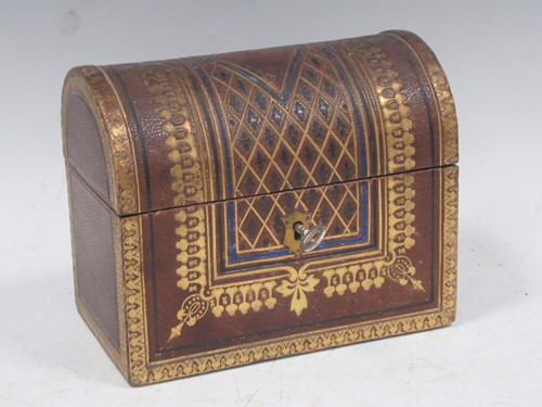 Lot 273 - A gilt tooled leather dome topped stationery...