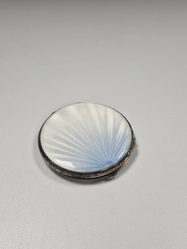 Lot 379 - A silver compact with guilloche enamel decoration